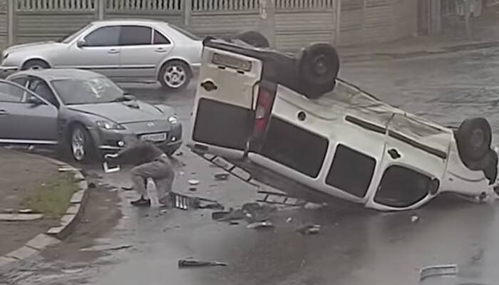 Watch: Car driver cheats death, thrown out of the window