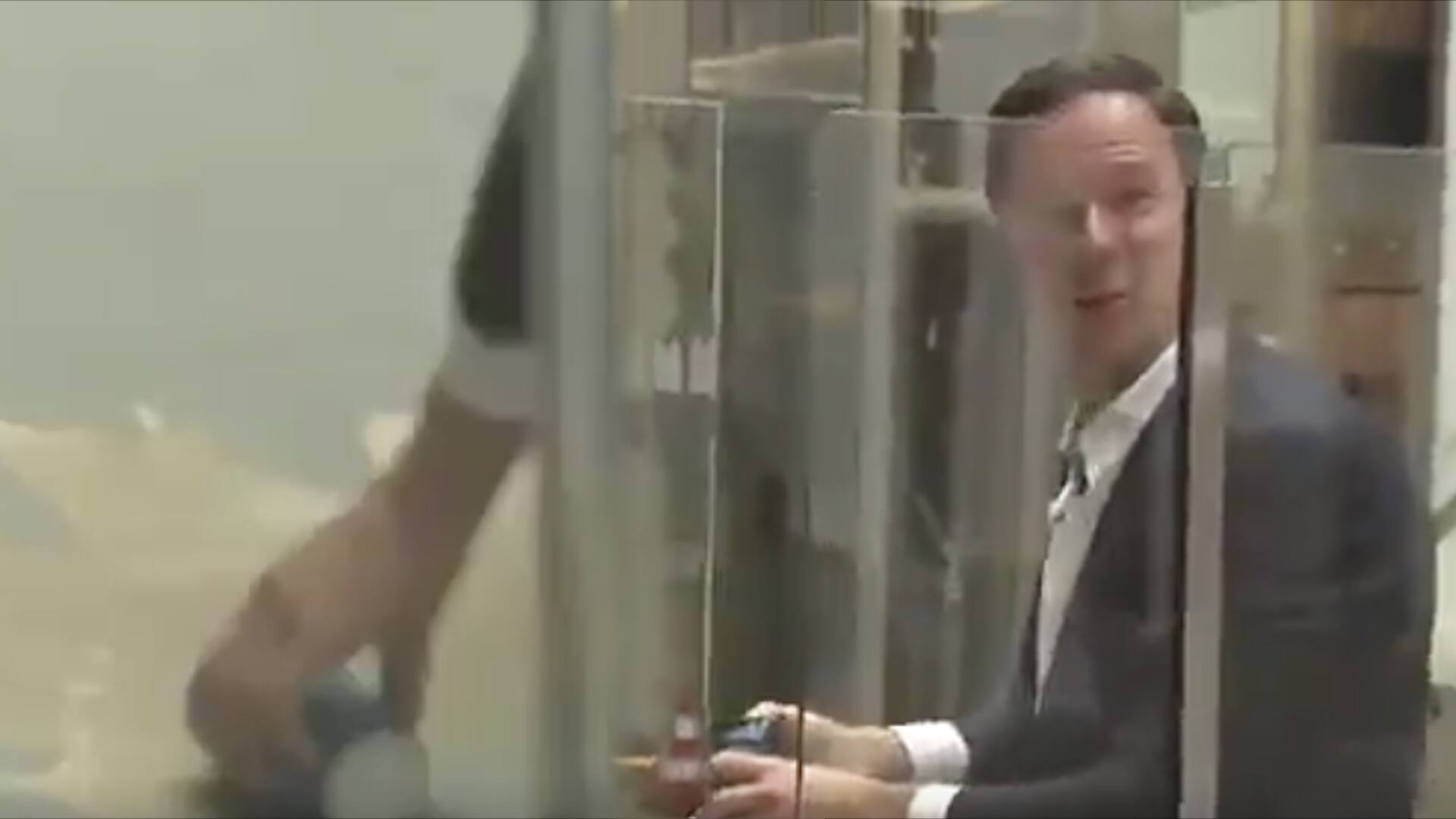 Dutch PM mops the spilt coffee in parliament [Viral Video]