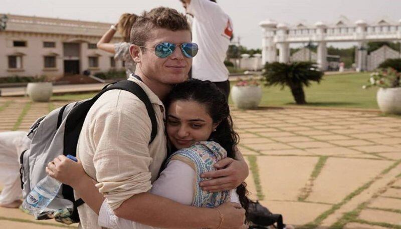 Nithya Menen tight hug to mystery man Photo Goes Viral