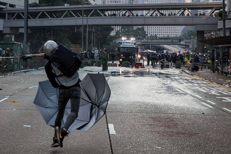 Ruckus in Hong Kong as protesters armed with bows and arrows gather at universities