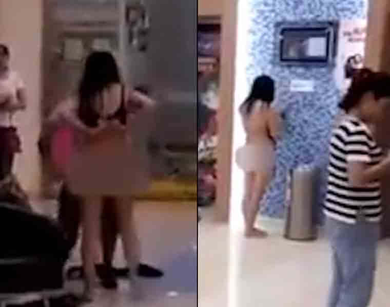 Women strips naked in shopping centre