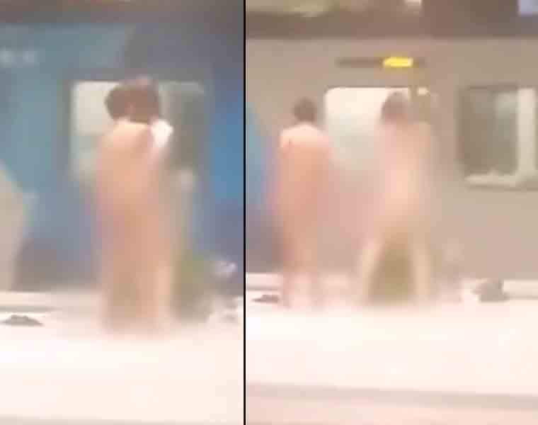 Two men caught on camera having sex in front of horrified people on a platform