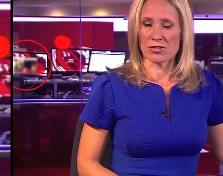 Adult content in the background as BBC anchor presents news