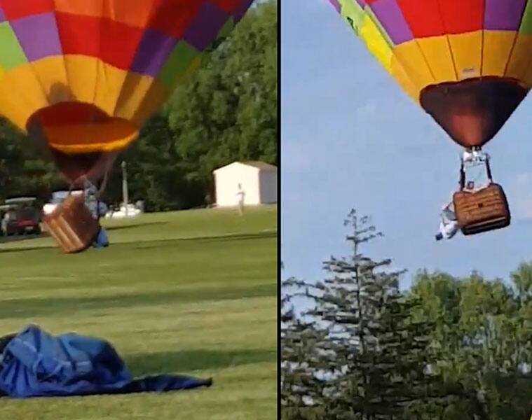 Man hangs upside down from balloon, watch what happens next