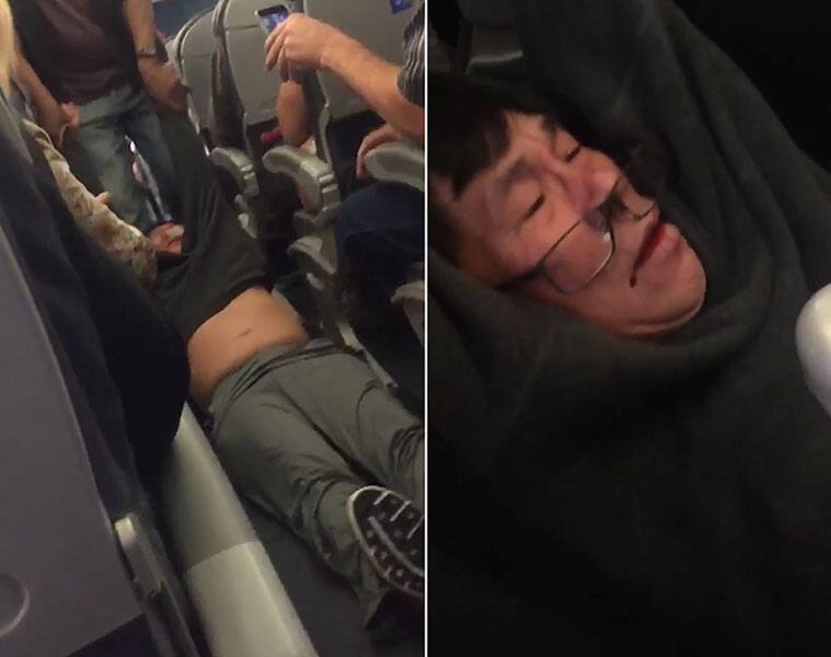 Shocking: Asian man physically dragged from plane because it was 'overbooked'