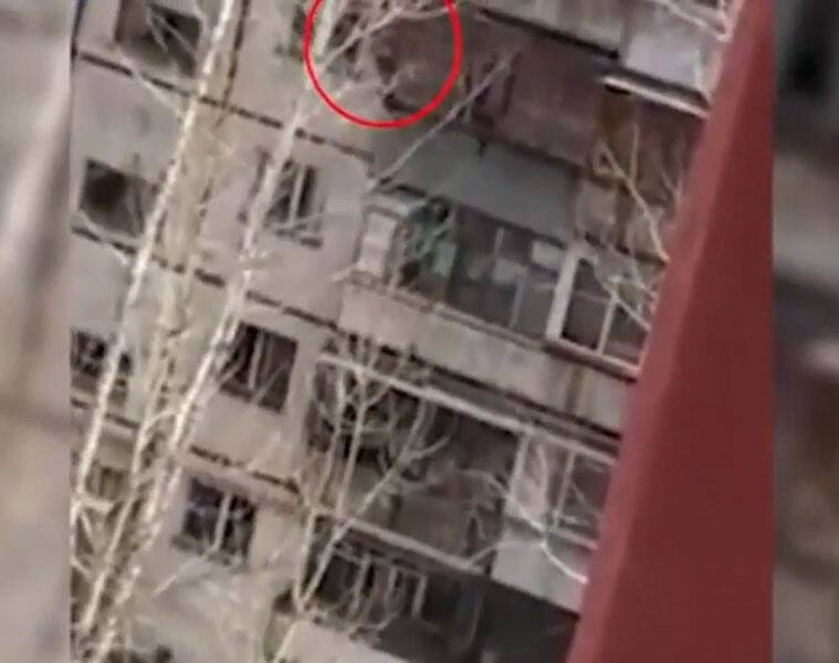 Caught on cam: Man climbs onto balcony, falls from fourth floor