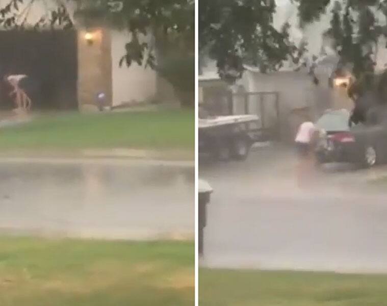 Hurricanes in Florida may come and go, but nothing can stop this woman from cleaning her car