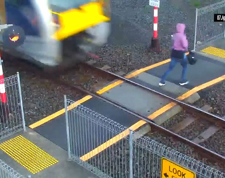 Woman walks in front of train, escapes death by inches