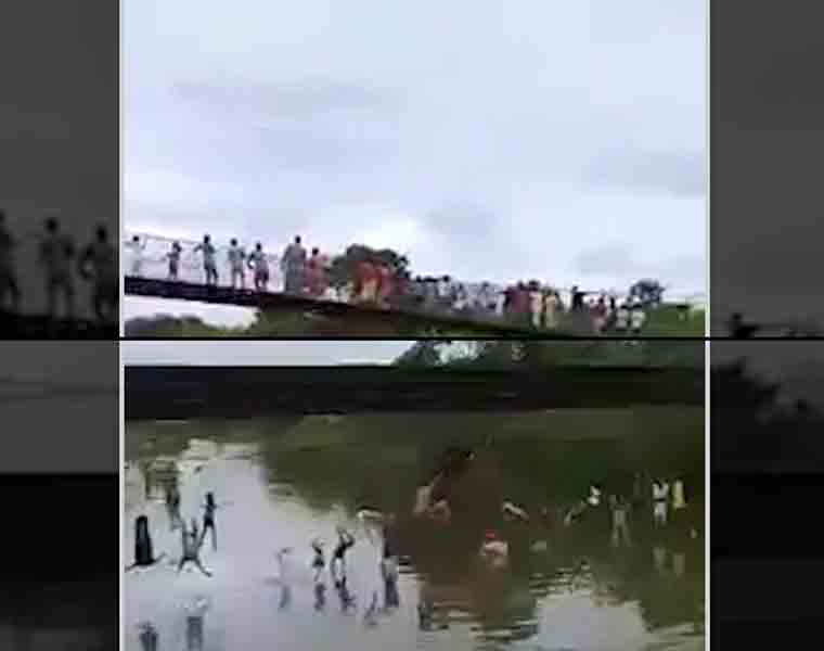 Bridge collapses, dozens tumble into water