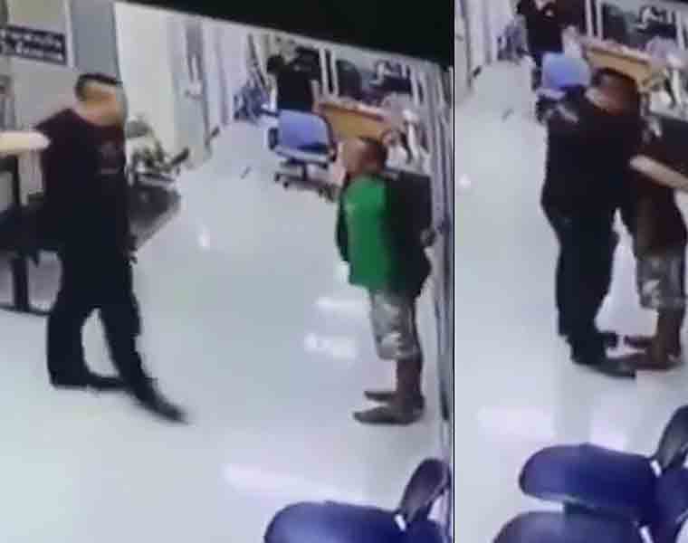 Policeman calms down knife-wielding assailant with a hug