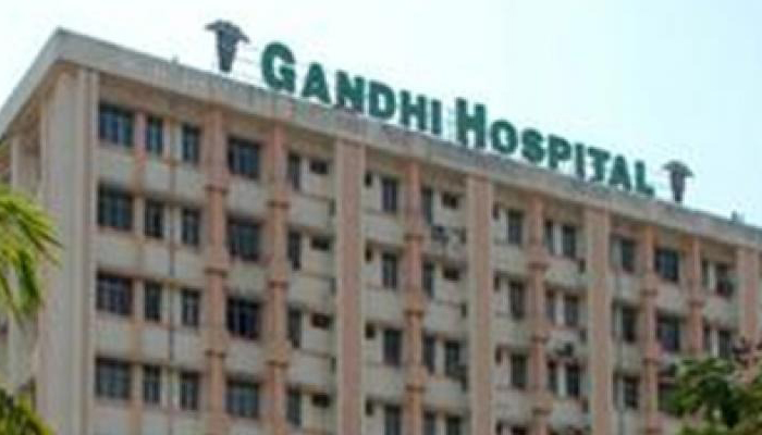 son along with parents serving corona patients in Gandhi hospital