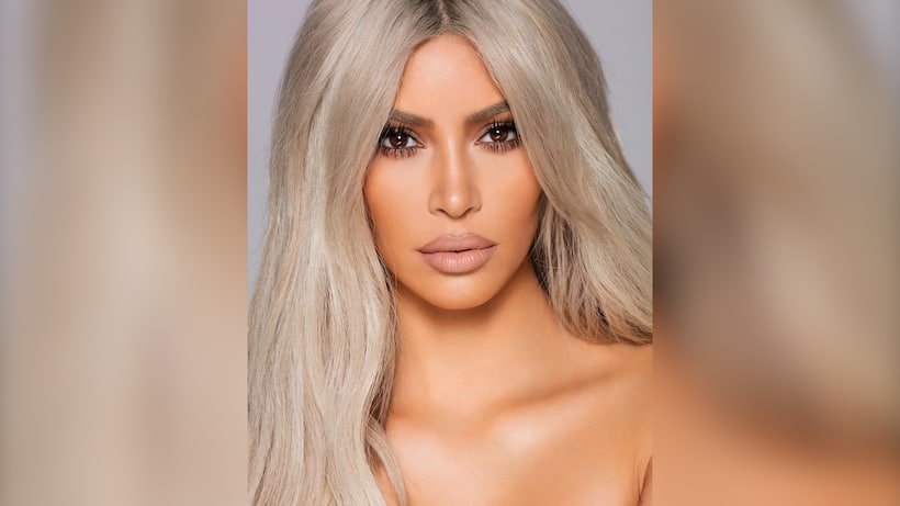 Kim Kardashian wore a see-through  nude tube top for a photo shoot; Appears topless at first