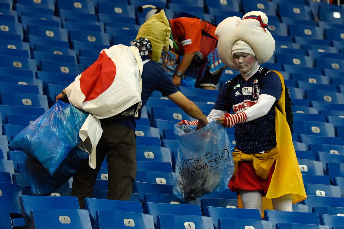 Even after losing, Japan fans still stayed behind to clean up the stands