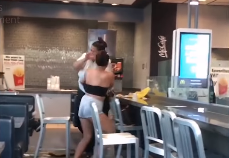 Mcdonald's employee beating up customer allegedly for throwing milk shake on her