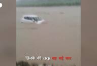 husband and wife stranded high speed flood river