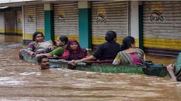 Kerala floods people stranded await rescue roads damaged