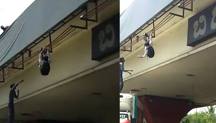 Bengaluru: Youth dangles from hoarding situated 40 feet above road, jumps on lorry