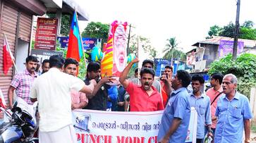 Kerala police AIYF AISF activists Yuva Morcha punch Modi challenge