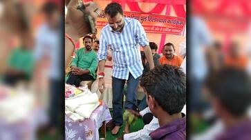 Member Parliament Nishikant Dubey BJP worker washing feet drinking water Facebook Twitter