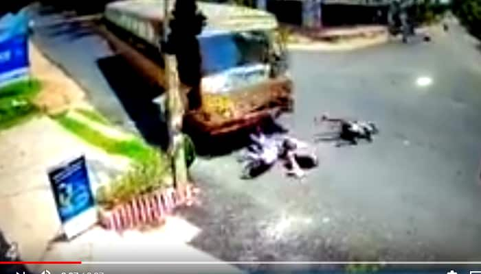 Three youth on a bike crash with bus