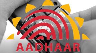 One crore fine banks telecom insist Adhaar Modi govt strict privacy norms