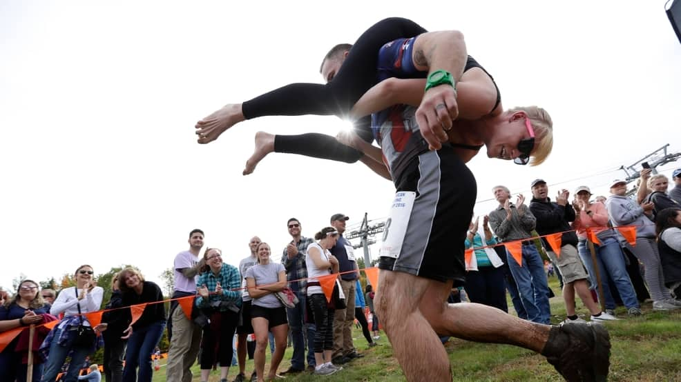 Husband wins spouse's weight in beer at wife-carrying contest