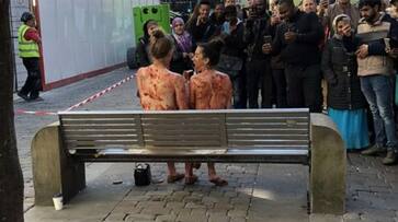 Two women's Naked in Manchester in the middle of market