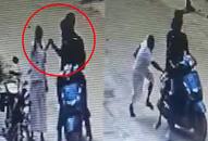 Miscreants bike snatch mobile phone from man drag victim along