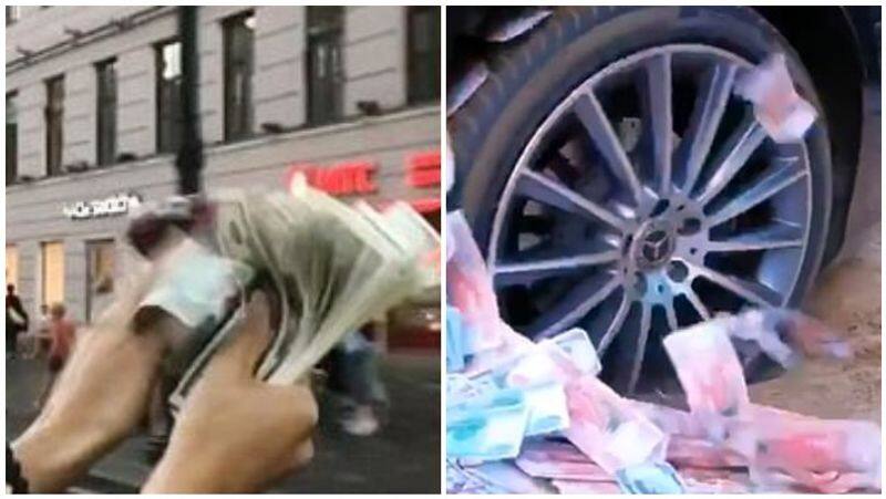 a richman thrown money in a street in russia