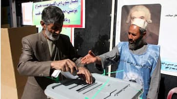 Afghanistan parliamentary elections bomb attacks voting Taliban