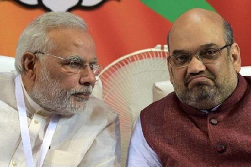 Two arrested for slamming modi amit shah in facebook