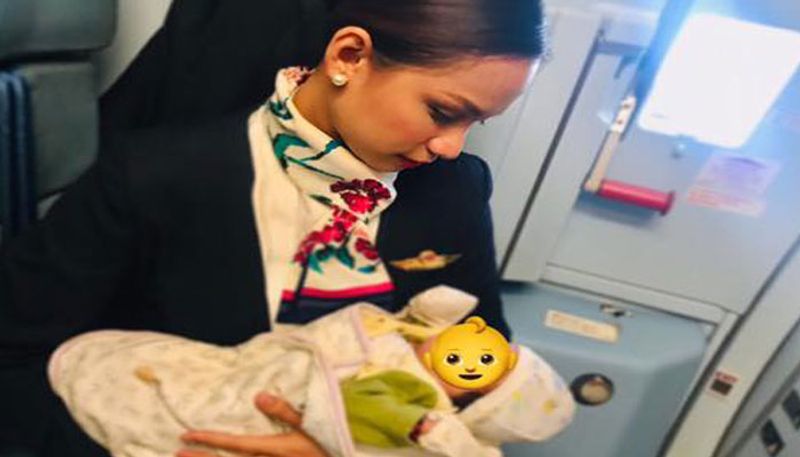 Kind air hostess breastfeeds strangers crying baby on board a flight