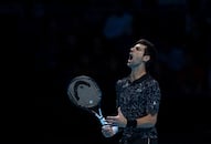 Novak Djokovic cruises past John Isner in ATP Finals opener