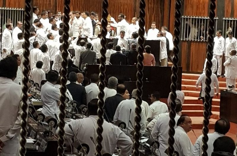 Sri Lanka amends the constitution to limit the President's powers.