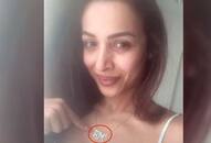 Malaika arora upload picture with 'AM' word locket