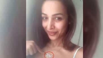 Malaika arora upload picture with 'AM' word locket