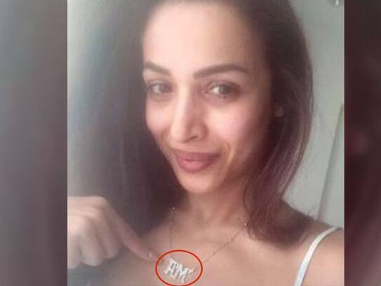 Malaika arora upload picture with 'AM' word locket