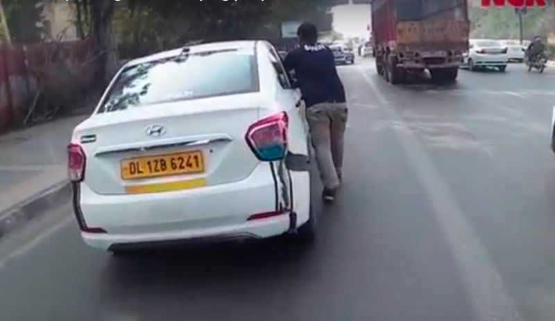 Royal Enfield rider pushed Hyundai Xcent through traffic road