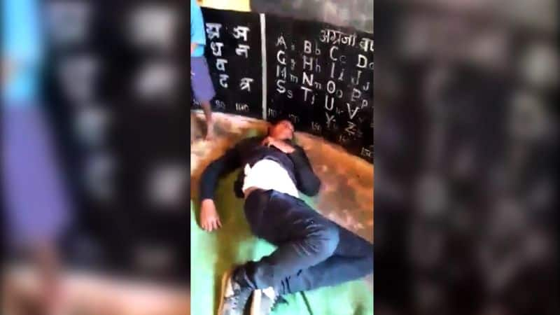 action against school teacher in mp who found drunk in school