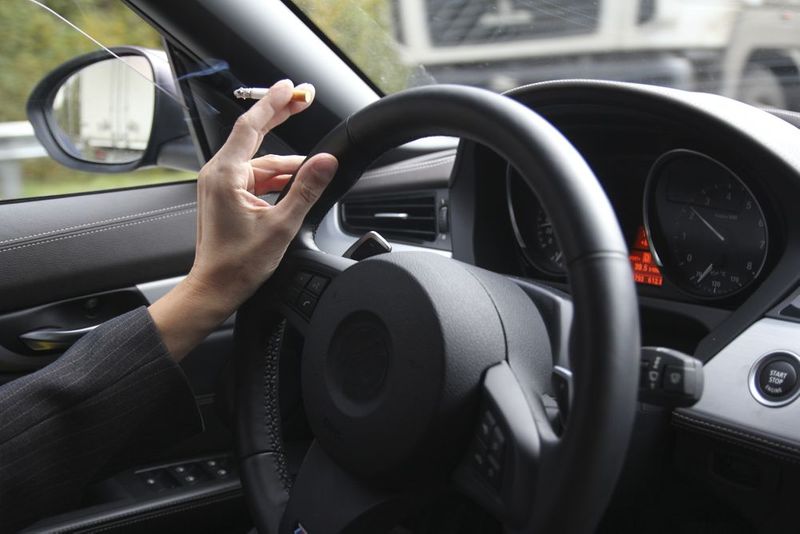 Smoking while driving dangerous as using the cell phone while driving