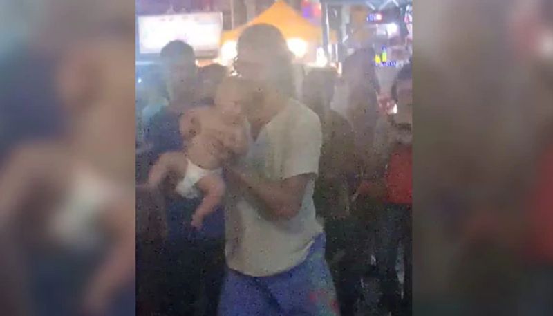 couple arrested at malesia for violently swinging their four month old baby at street for funding world tour