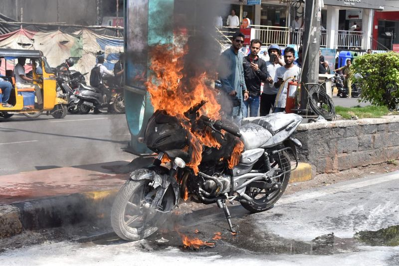 New bike catch fire during the ride biker escape with unhurt at Hyderabad