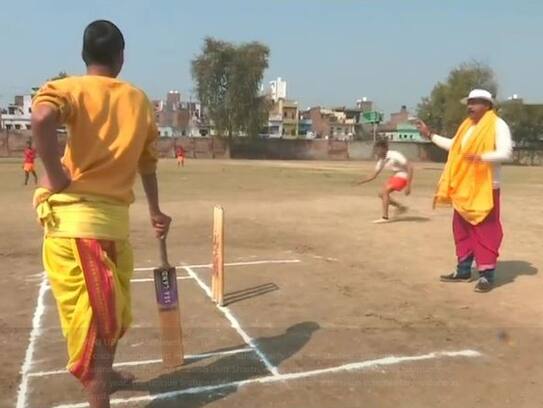 batting bowling fielding by wearing dhoti