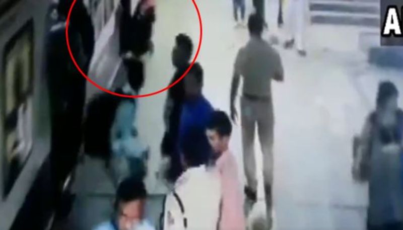 passenger rescued women who falling in railway track