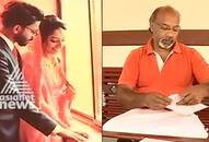 Kerala couple hands wedding invitation book encourage reading