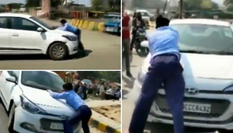 youth drags cab driver on cars bonnet in ghaziabad