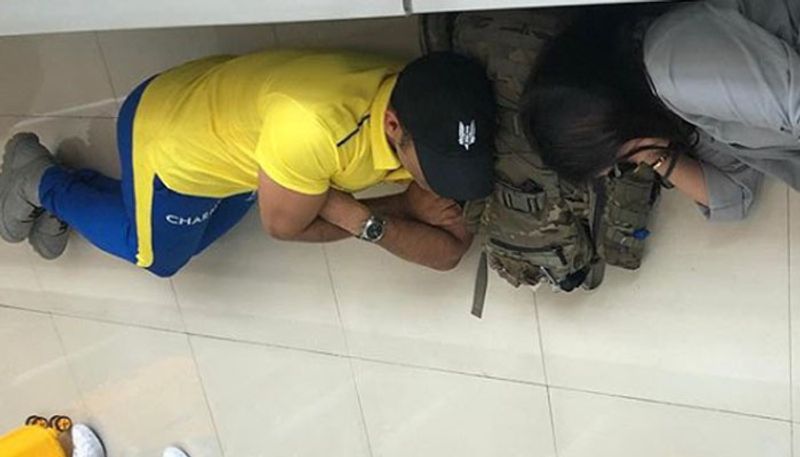 Dhoni  sleep on airport floor share picture on Instagram