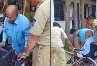 Physically challenged elderly man arrives wheelchair cast vote