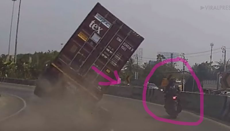 Motorbike Rider Almost Crushed By Shipping Container