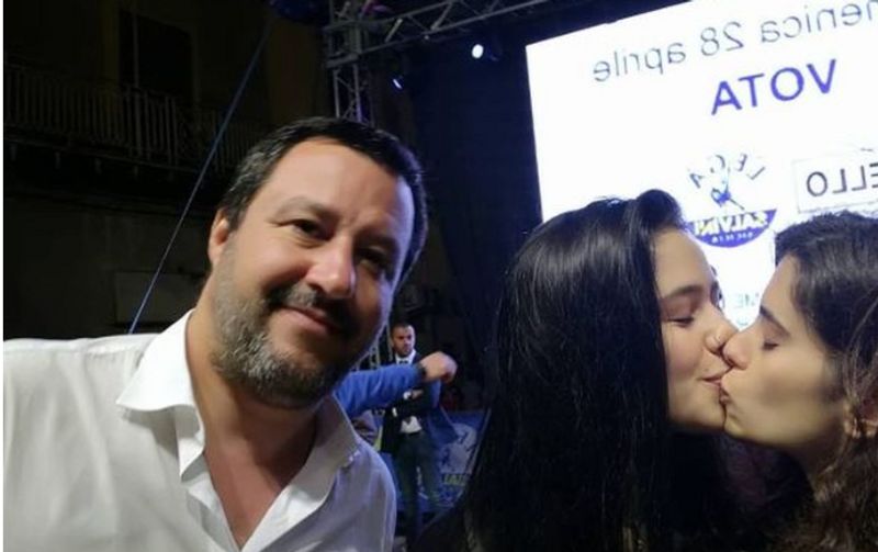 Italian anti gay politician Matteo Salvini photobombed by young women kissing